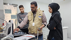 A photograph of Project HOPE team members in our clinic in Gaza starting up newly-delivered medical equipment.