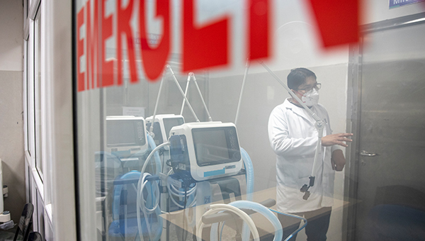 Health worker with lifesaving medical equipment.