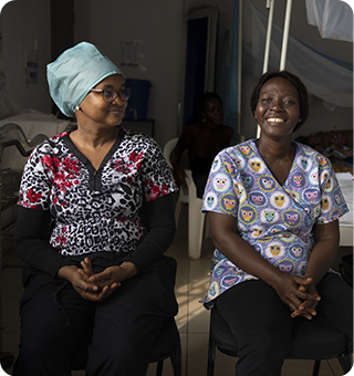 Dalanda (left) and Yealie (right), midwives at Waterloo Community Health Center, a small hospital in Western Area Rural, Sierra Leone.