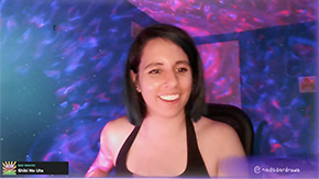 A woman wearing a black tank top on a Twitch screenshot is smiling in a purple and pink galaxy background. The text at the bottom of the screen reads: @nadsdardraws.